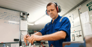 img of someone repairing a yachts electrical system